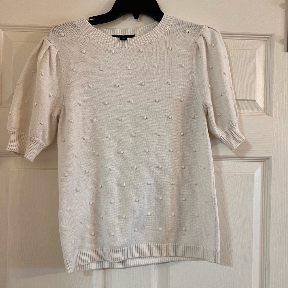 Cream short sleeve sweater with raised dot detailing.